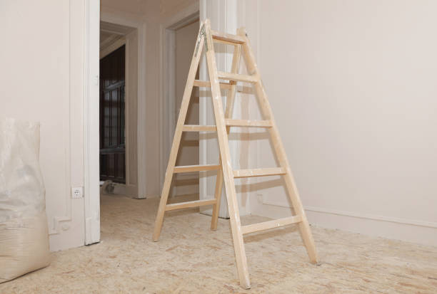 Home renovation by yourself. Wall painting, Painter's ladder in the middle of the room.